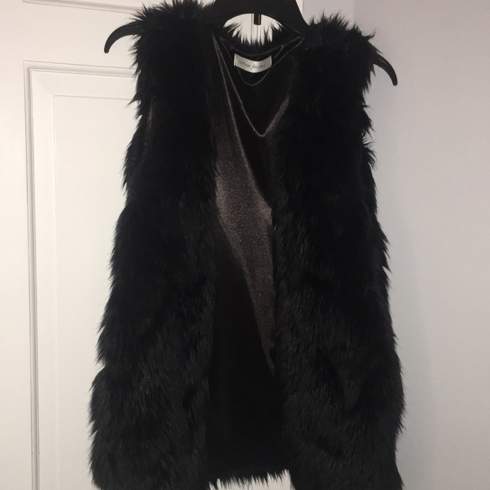 Oversized black faux fur vest
